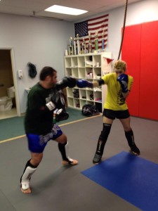Miss Chrissy is seen here getting some sparring in with one of our other instructors during a Kickboxing class. 